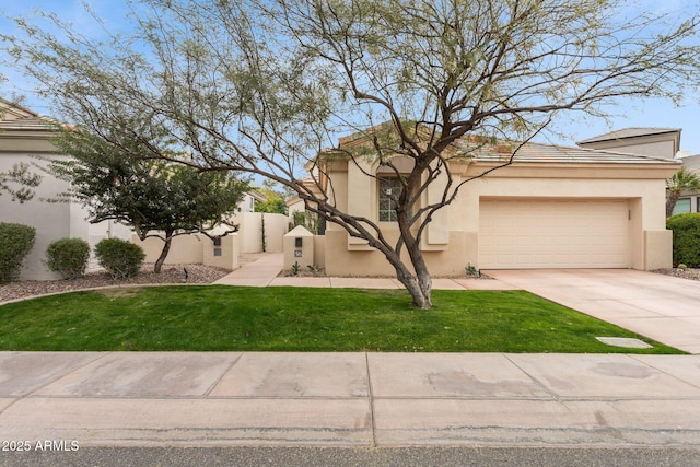 view of front of house with a garage and a front lawn