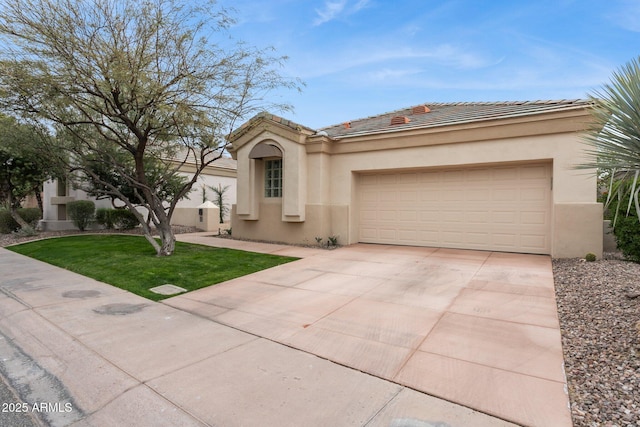 view of front of property featuring a garage and a front lawn