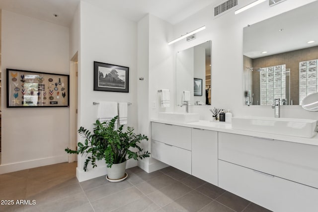 bathroom with tile patterned floors and vanity