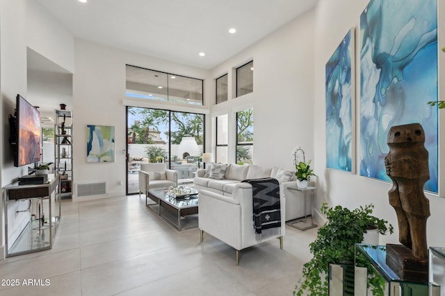 living room with a high ceiling