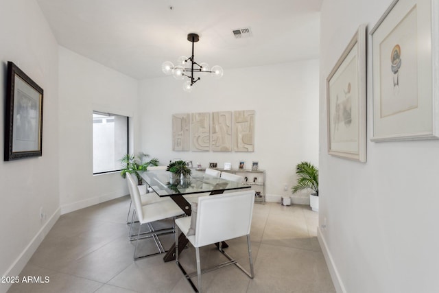 dining space with an inviting chandelier