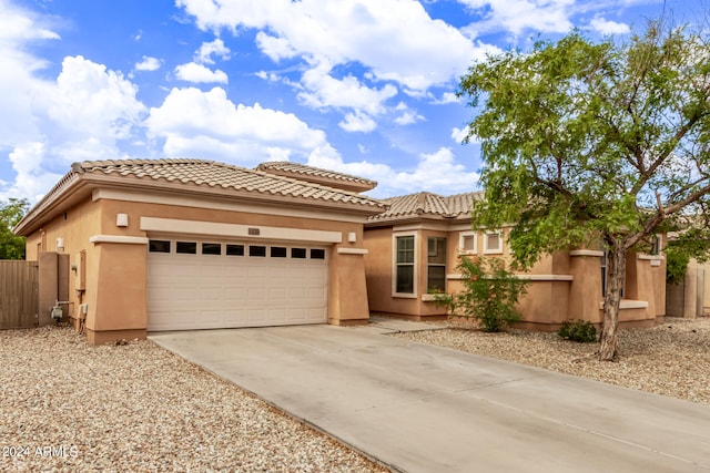 view of front of property with a garage