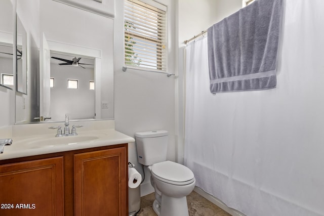 full bathroom featuring ceiling fan, toilet, tile patterned flooring, vanity, and shower / tub combo