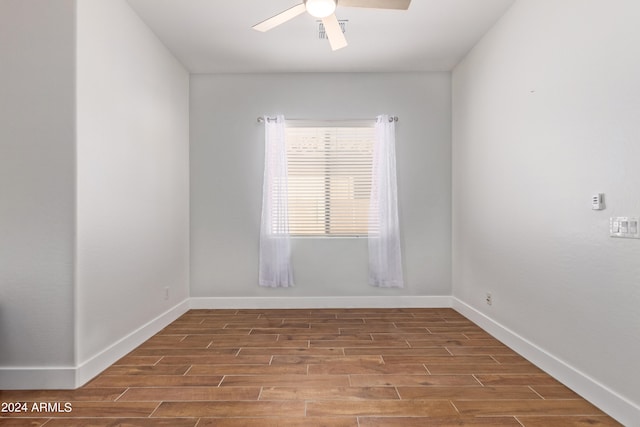 spare room with ceiling fan and hardwood / wood-style floors