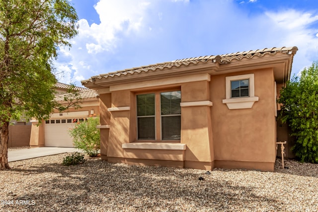 view of home's exterior with a garage