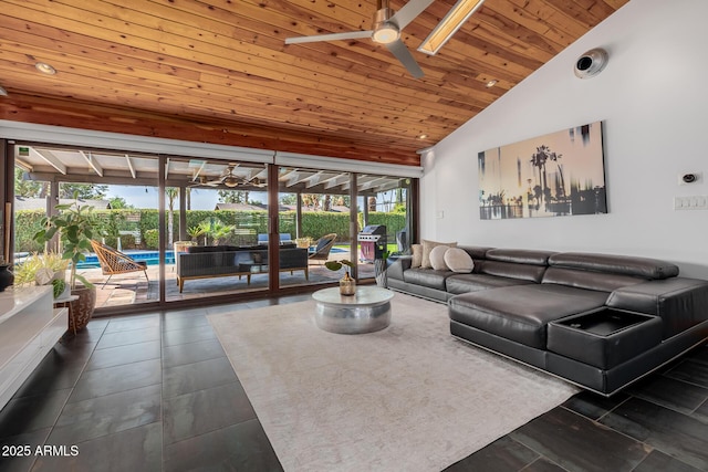 living area with dark tile patterned floors, a sunroom, wood ceiling, vaulted ceiling, and a ceiling fan