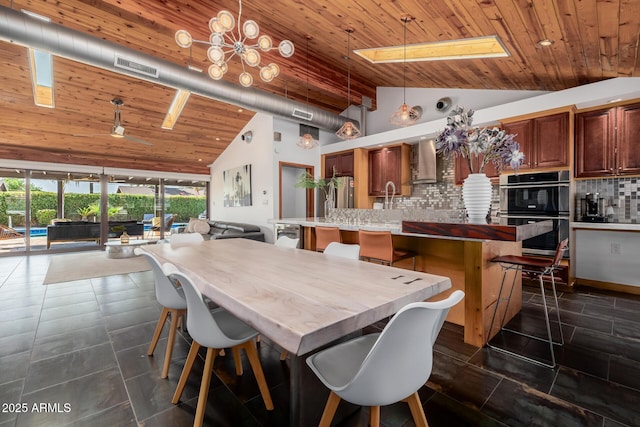 dining space with a chandelier, wooden ceiling, visible vents, and high vaulted ceiling