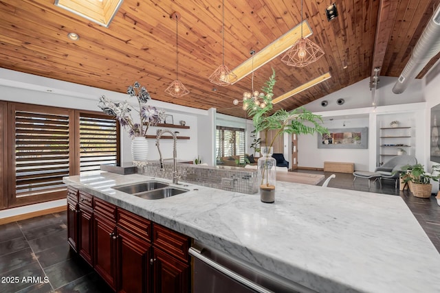 kitchen featuring hanging light fixtures, open floor plan, a sink, dark brown cabinets, and wooden ceiling