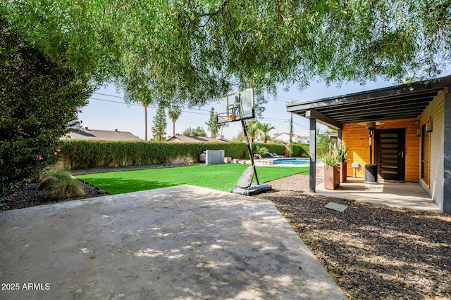 view of patio with a fenced in pool and fence