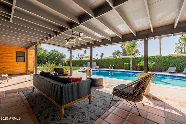 view of swimming pool with a patio area, ceiling fan, and a fenced in pool