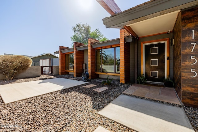 entrance to property featuring a patio area