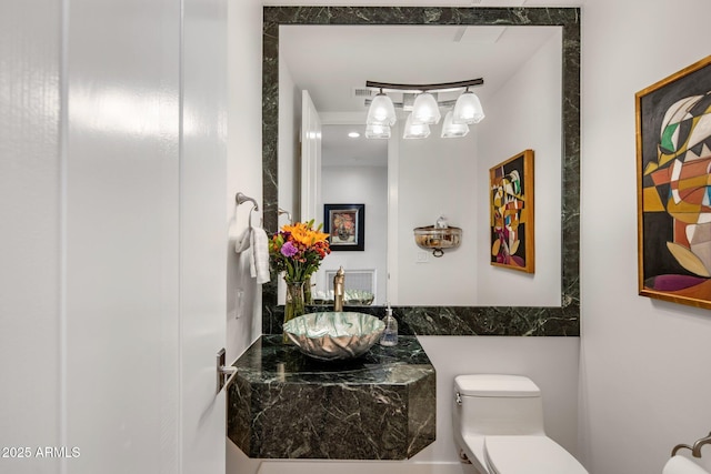 bathroom with a sink and toilet