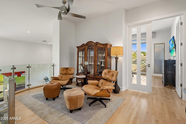 sitting room featuring a ceiling fan and wood finished floors