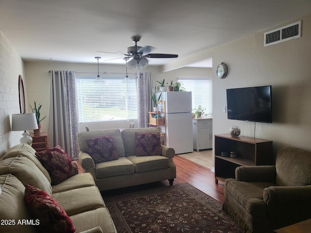 8221 E Garfield St Unit L109, Scottsdale, AZ 85257 - living area featuring wood finished floors and a ceiling fan
