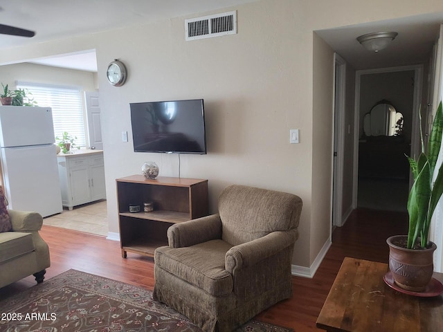 8221 E Garfield St Unit L109, Scottsdale, AZ 85257 - living area with light wood-style floors