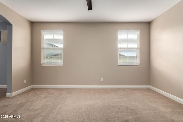 carpeted empty room with a wealth of natural light