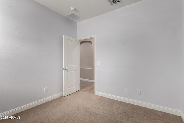 spare room with light carpet