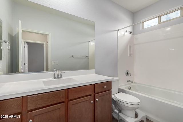 full bathroom featuring toilet, vanity, and shower / bathing tub combination