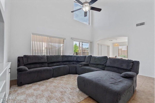 4323 E Dublin St, Gilbert, AZ 85295 - tiled living room with ceiling fan, a towering ceiling, and baseboards