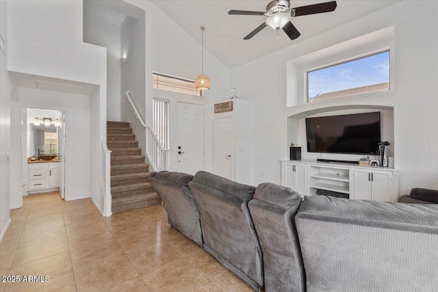 4323 E Dublin St, Gilbert, AZ 85295 - living area with stairway, ceiling fan, high vaulted ceiling, light tile patterned floors, and baseboards