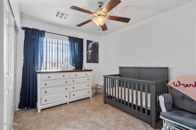 4323 E Dublin St, Gilbert, AZ 85295 - bedroom featuring light colored carpet, a nursery area, and a ceiling fan