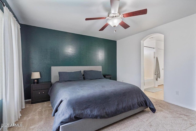 4323 E Dublin St, Gilbert, AZ 85295 - carpeted bedroom with arched walkways, ensuite bathroom, and ceiling fan