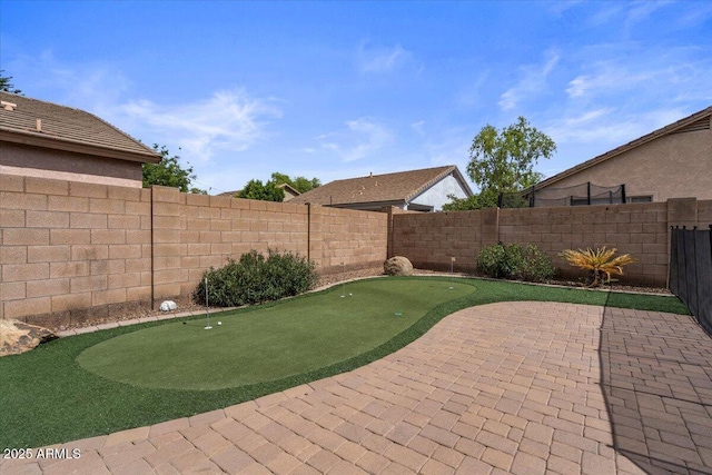 4323 E Dublin St, Gilbert, AZ 85295 - fenced backyard featuring a putting area and a patio