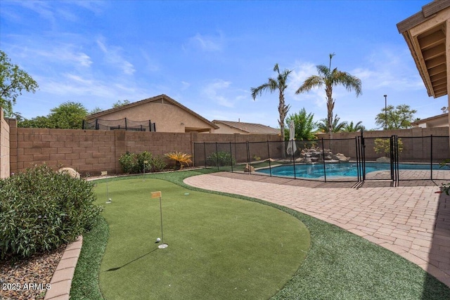 4323 E Dublin St, Gilbert, AZ 85295 - view of swimming pool featuring a putting green, a patio area, and a fenced backyard