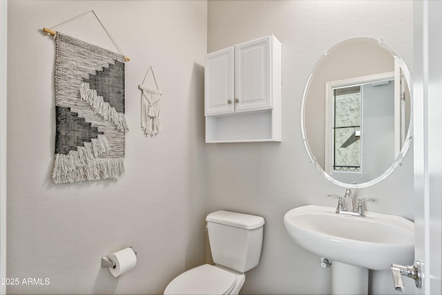 bathroom with sink and toilet