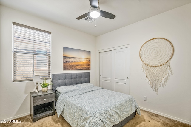 bedroom featuring ceiling fan, carpet floors, and a closet