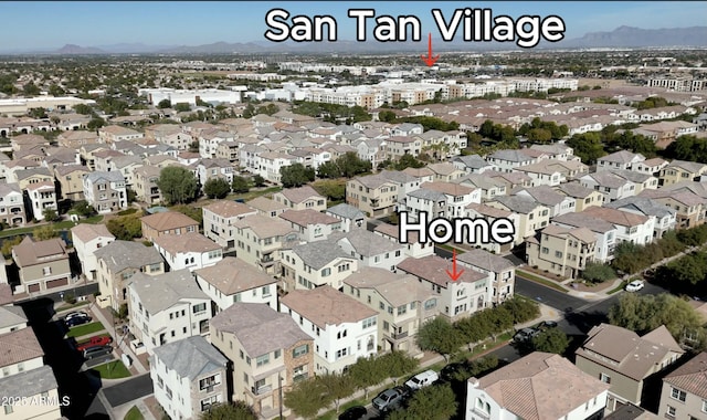 birds eye view of property featuring a mountain view