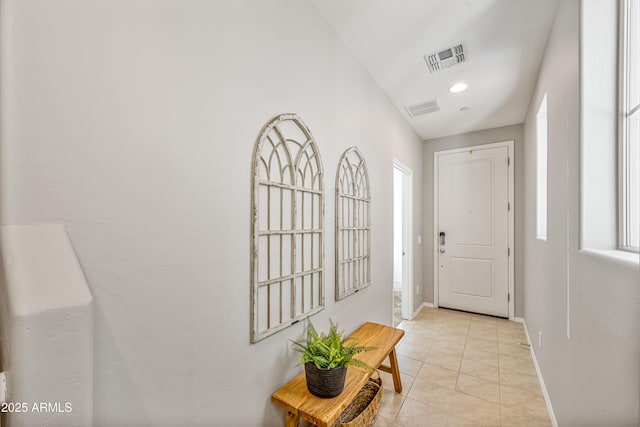 entryway with light tile patterned floors