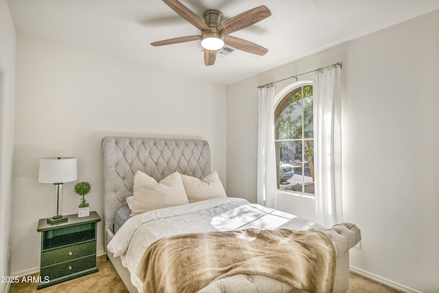 carpeted bedroom with ceiling fan