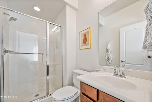 bathroom with vanity, toilet, and walk in shower