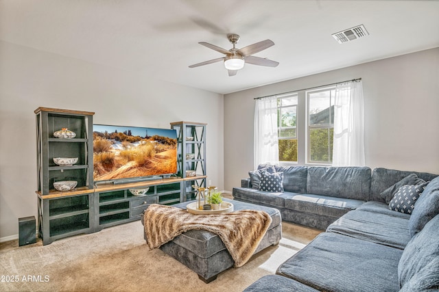 living room featuring ceiling fan and carpet flooring