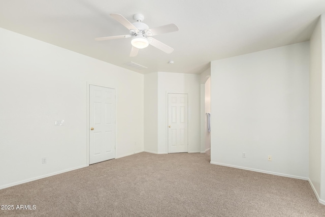 12355 W Hadley St, Avondale, AZ 85323 - unfurnished room with light carpet, a ceiling fan, and baseboards