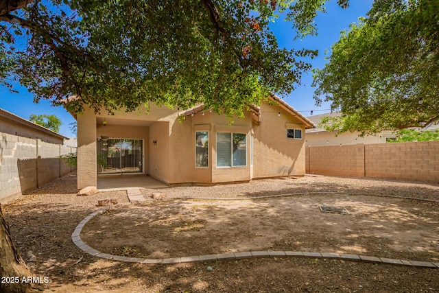 12355 W Hadley St, Avondale, AZ 85323 - rear view of house with stucco siding, a fenced backyard, and a patio