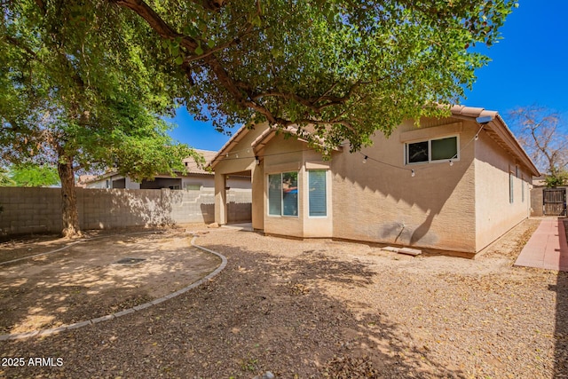 12355 W Hadley St, Avondale, AZ 85323 - rear view of house featuring a fenced backyard, stucco siding, and a patio
