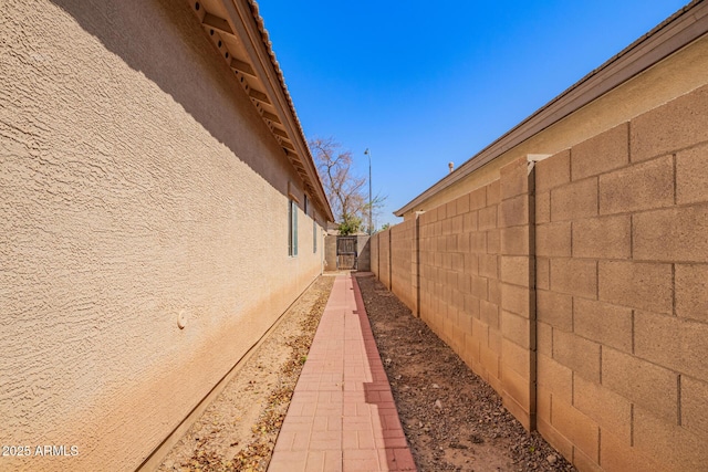 12355 W Hadley St, Avondale, AZ 85323 - view of side of home with stucco siding and fence