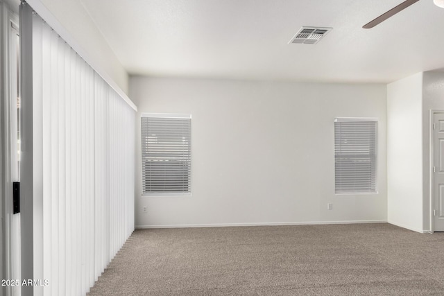 12355 W Hadley St, Avondale, AZ 85323 - carpeted empty room with a ceiling fan and baseboards