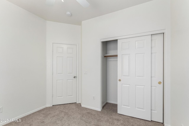 12355 W Hadley St, Avondale, AZ 85323 - unfurnished bedroom with carpet floors, a closet, baseboards, and a ceiling fan