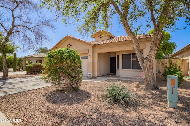 12355 W Hadley St, Avondale, AZ 85323 - mediterranean / spanish home featuring stucco siding, fence, and a tiled roof