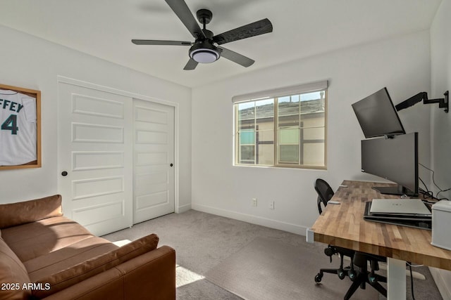 office space with ceiling fan and light colored carpet