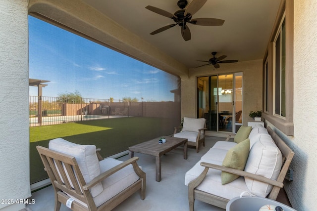 view of patio with ceiling fan and an outdoor living space