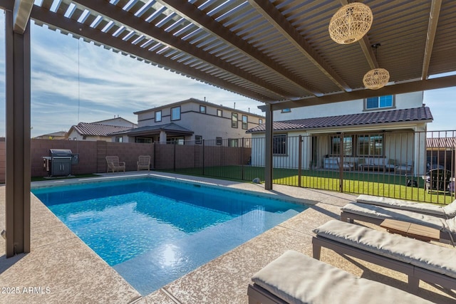 view of pool with a lawn, a patio area, and a pergola