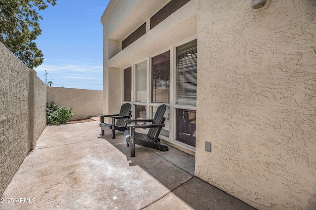 view of patio with fence