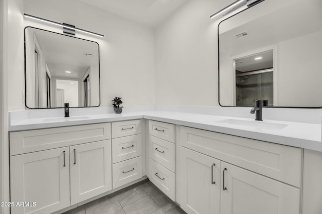 full bathroom with vanity, a stall shower, and marble finish flooring
