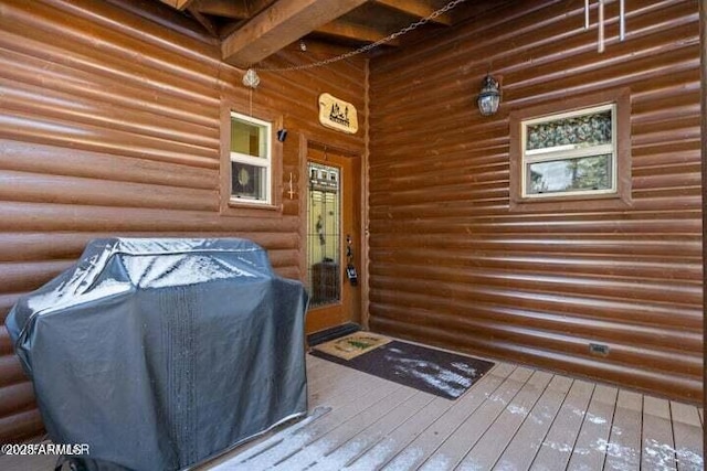 entrance to property with a wooden deck