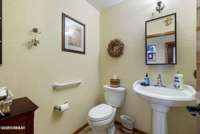 bathroom featuring toilet