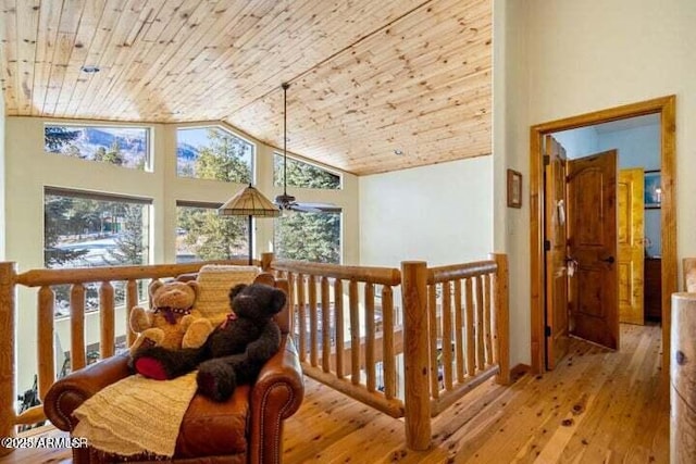 corridor featuring high vaulted ceiling, wood ceiling, and light hardwood / wood-style flooring